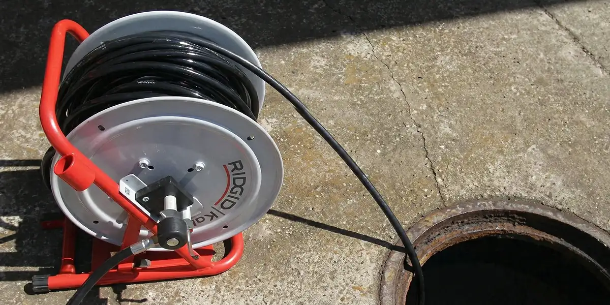 sewer rodding equipment prepared to clear clogged sewer lines in Overland Park, KS